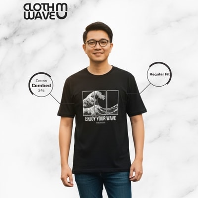 The shirt is made of Cotton Combed 24s, offering a regular fit for a comfortable look and feel. The design says 'ENJOY YOUR WAVE' beneath the image. The background is neutral, emphasizing the shirt's details
