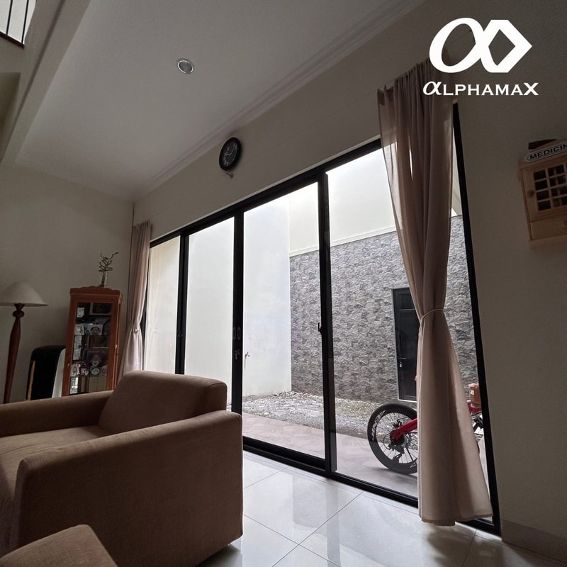 Pintu Sliding Aluminium Alphamax: Solusi Estetis, Fungsional, dan Arsitektural untuk Ruang Modern